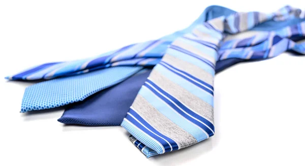 A group of blue neckties on a white background — Stock Photo, Image