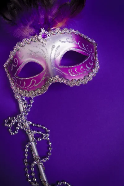 Purple Mardi-Gras or Venetian mask on purple background — Stock Photo, Image