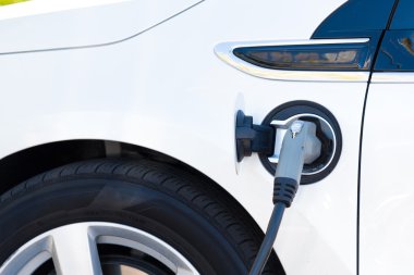Electric car charging clipart