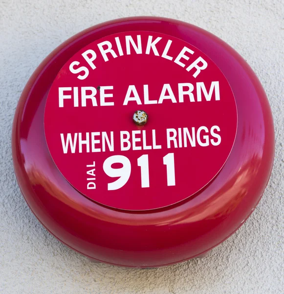 Campana di allarme di fuoco rossa su una parete — Foto Stock