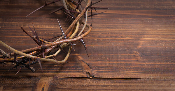 Crown of thorns on a wooden background - Easter