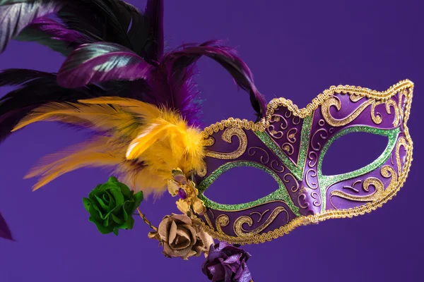 Mardi Gras or carnival mask on purple background — Stock Photo, Image