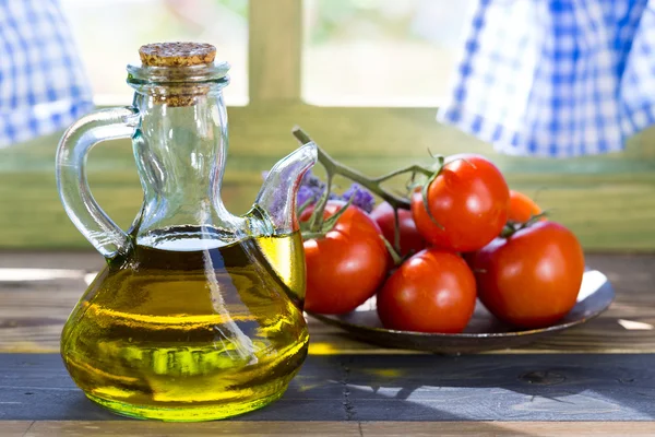 Olive oil and tomatoes — Stock Photo, Image