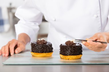 Chef finishing a cake clipart