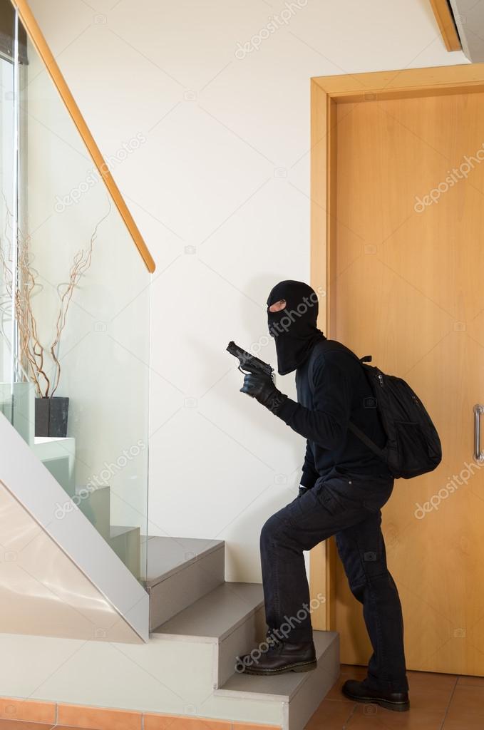 Burglar stealing