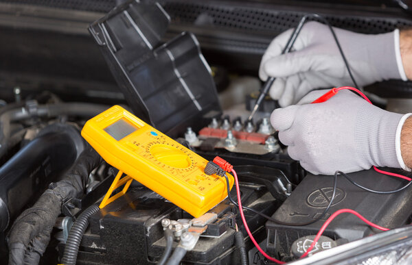 Car mechanic with a tablet