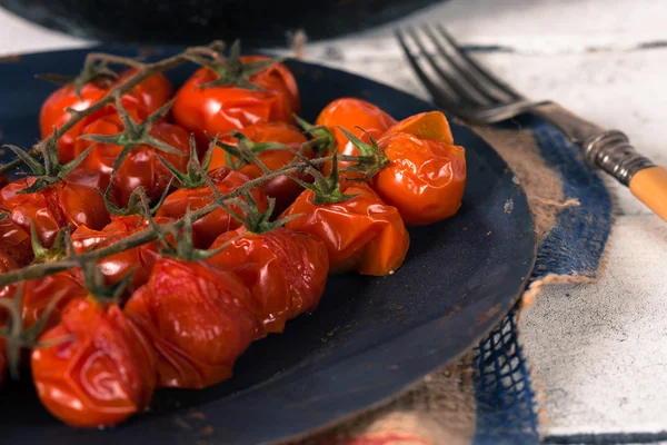 Pomodori ciliegia al forno Immagine Stock