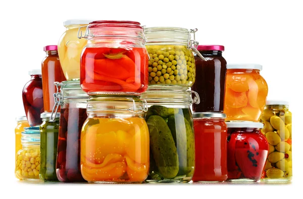 Jars with pickled vegetables, fruity compotes and jams isolated — Stock Photo, Image