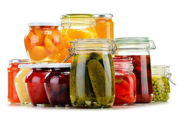 Jars with pickled vegetables, fruity compotes and jams isolated — Stock Photo, Image