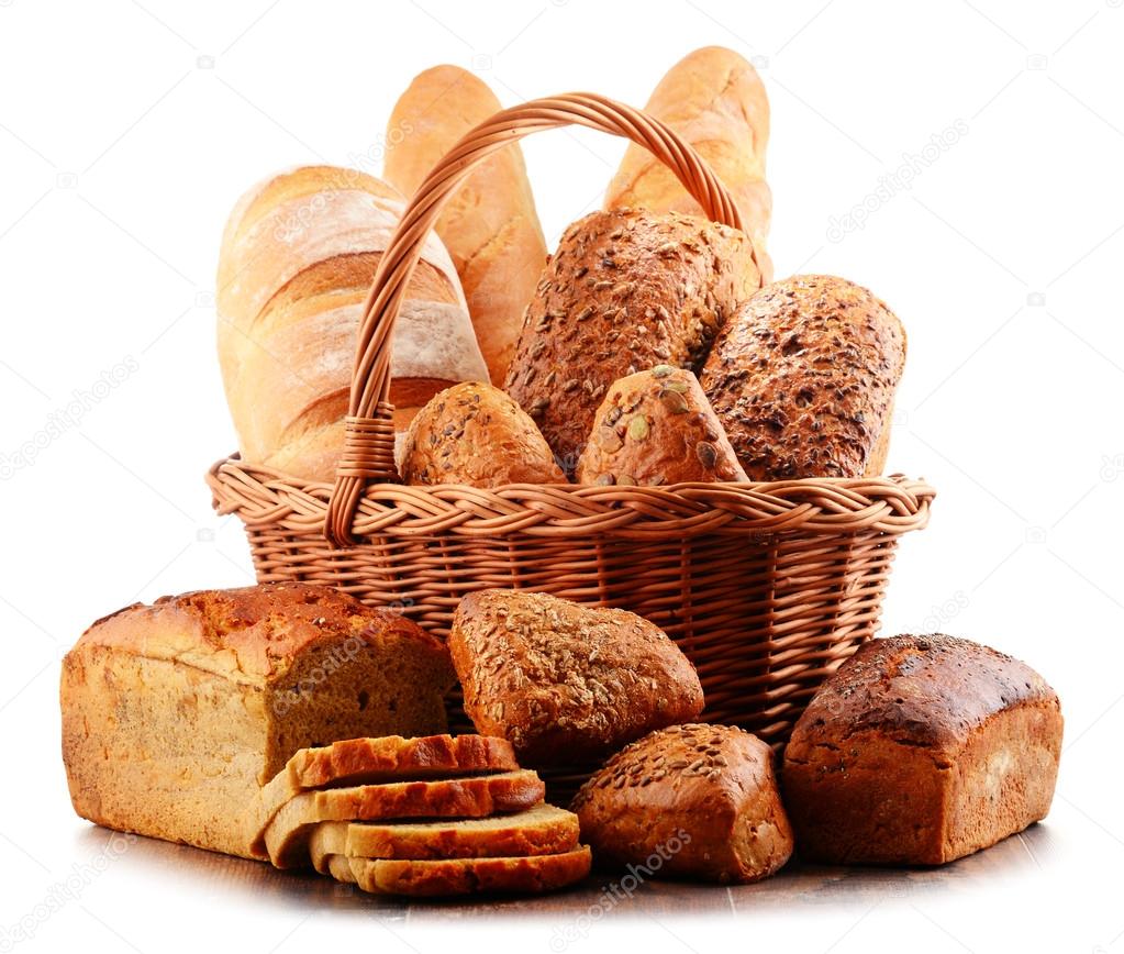 Wicker basket with assorted baking products isolated on white