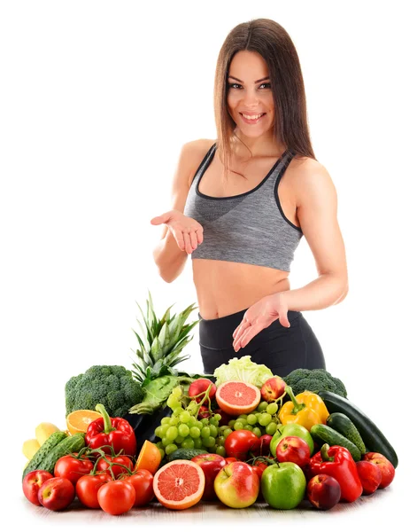 Young woman with variety of organic vegetables and fruits — Stock Photo, Image