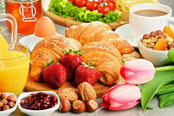 Breakfast consisting of croissants, coffee, fruits, orange juice — Stock Photo, Image