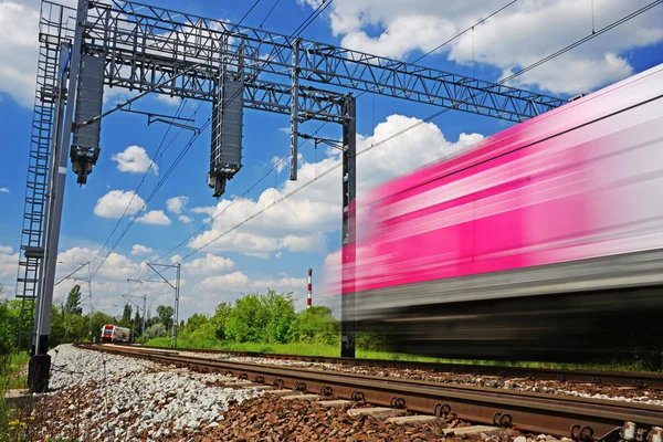 Modern electric passenger train moving on full speed — Stock Photo, Image