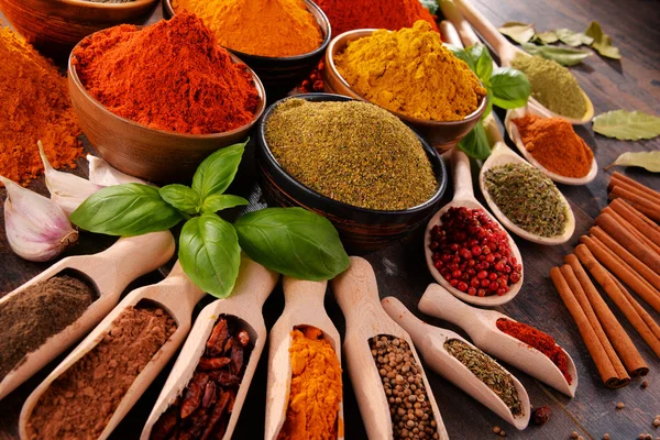 Variety of spices on kitchen table — Stock Photo, Image