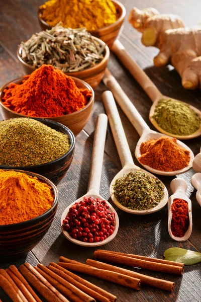 Variety of spices on kitchen table — Stock Photo, Image