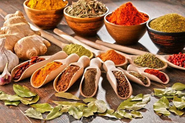 Variety of spices on kitchen table — Stock Photo, Image