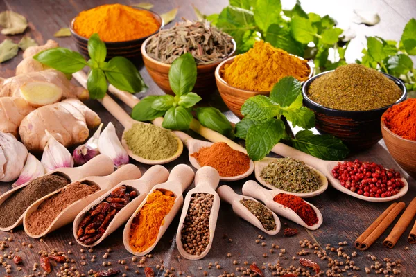 Variety of spices on kitchen table — Stock Photo, Image