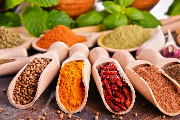 Variety of spices on kitchen table — Stock Photo, Image