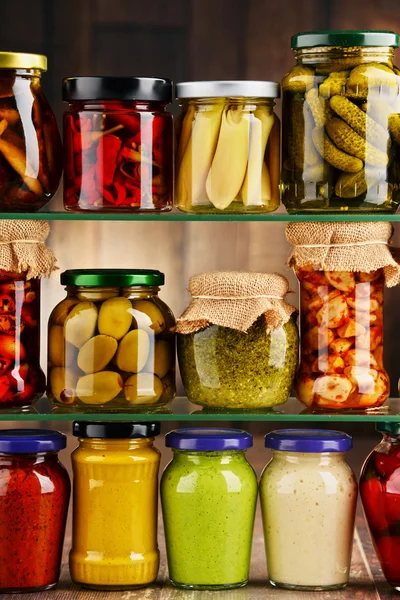 Jars with variety of pickled vegetables. — Stock Photo, Image