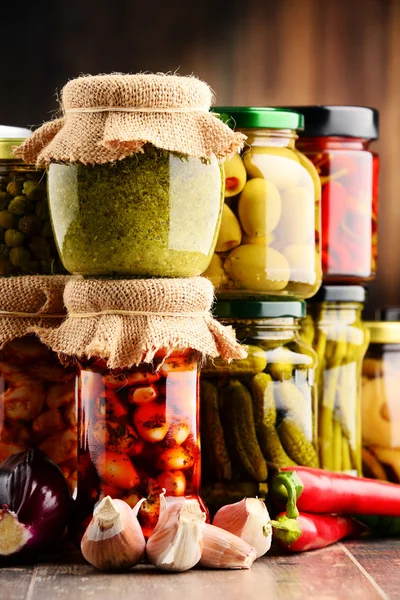 Jars with variety of pickled vegetables. — Stock Photo, Image