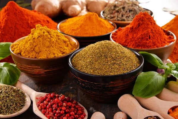 Variety of spices on kitchen table — Stock Photo, Image