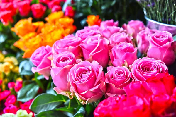 Roses in flower shop. Cut flowers at the street stall