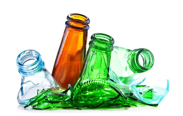 Broken glass bottles over white background. Recycling.