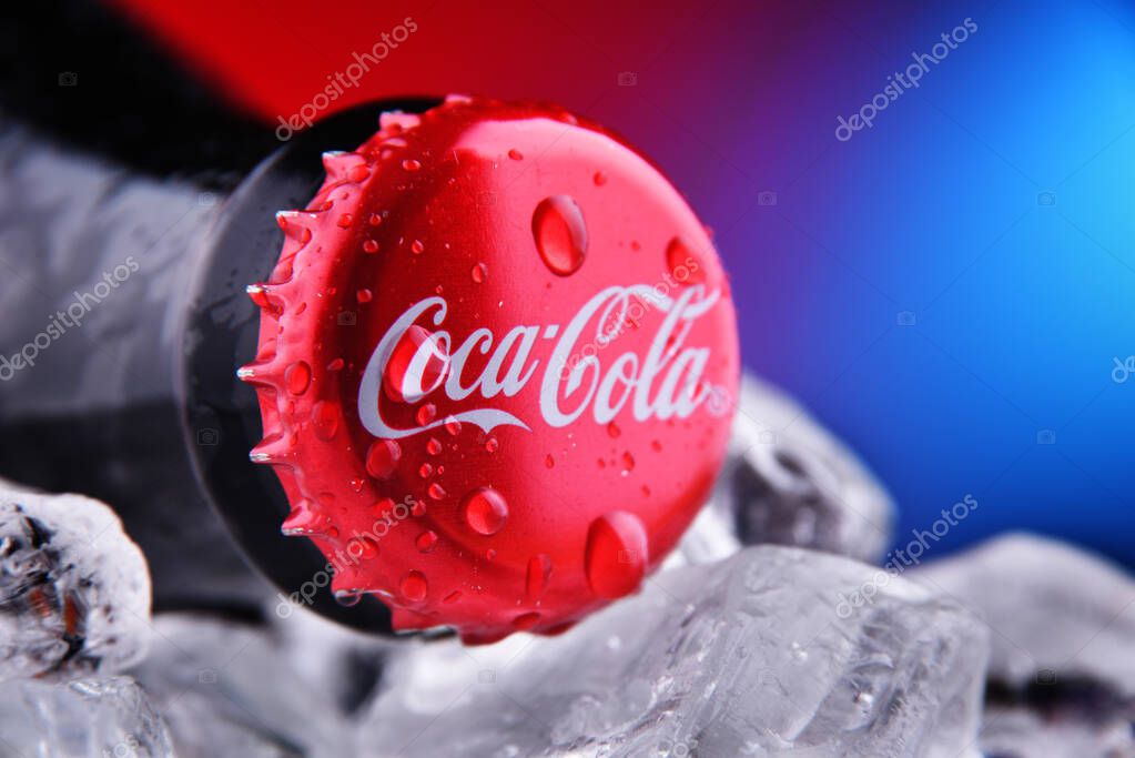 POZNAN, POL - FEB 25, 2021: Crown cap on a Coca-Cola bottle, a carbonated soft drink manufactured by The Coca-Cola Company headquartered in Atlanta, Georgia, USA