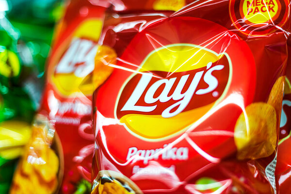 POZNAN, POL - APR 13, 2021: Packets of Lay's potato chips, popular American brand founded in 1932 and owned by PepsiCo since 1965.