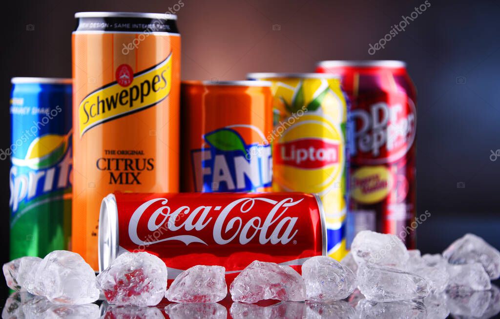 POZNAN, POL - MAY 13, 2021: Cans of popular soft drink brands including Coca Cola, Fanta, Dr Pepper, Sprite, Lipton Ice Tea and Schweppes