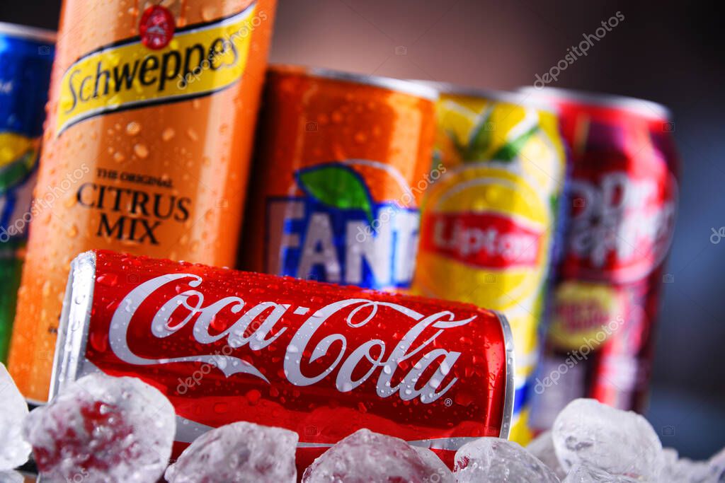 POZNAN, POL - MAY 13, 2021: Cans of popular soft drink brands including Coca Cola, Fanta, Dr Pepper, Sprite, Lipton Ice Tea and Schweppes