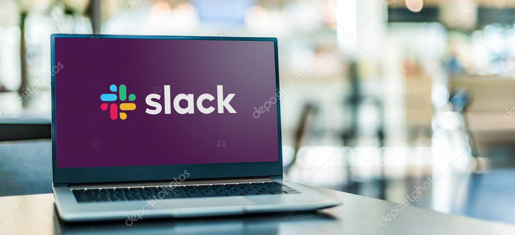 POZNAN, POL - SEP 23, 2020: Laptop computer displaying logo of Slack, a proprietary business communication platform developed by American software company Slack Technologies