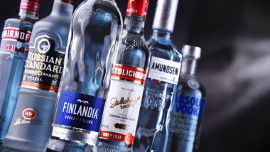 POZNAN, POL - MAY 12, 2021: Bottles of assorted global vodka brands clipart