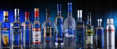 POZNAN, POL - AUG 06, 2021: Bottles of assorted global vodka brands clipart