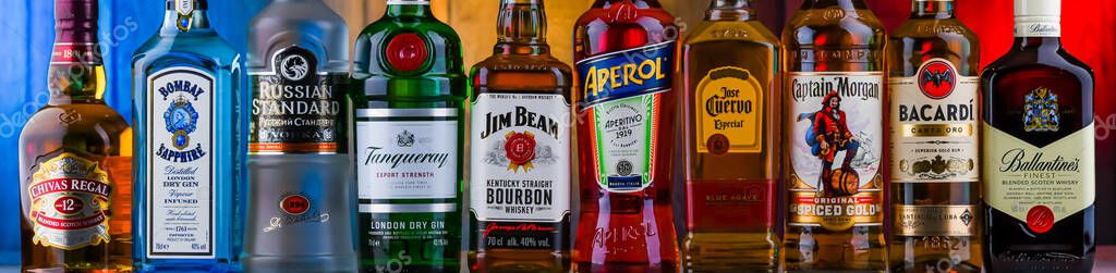 POZNAN, POL - AUG 05, 2021: Bottles of assorted global hard  liquor brands including whiskey, vodka, tequila and gin