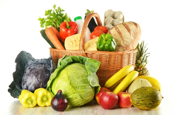 Groceries in wicker basket isolated on white — Stock Photo, Image