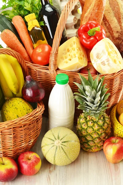 Groceries in wicker basket isolated on white — Stock Photo, Image