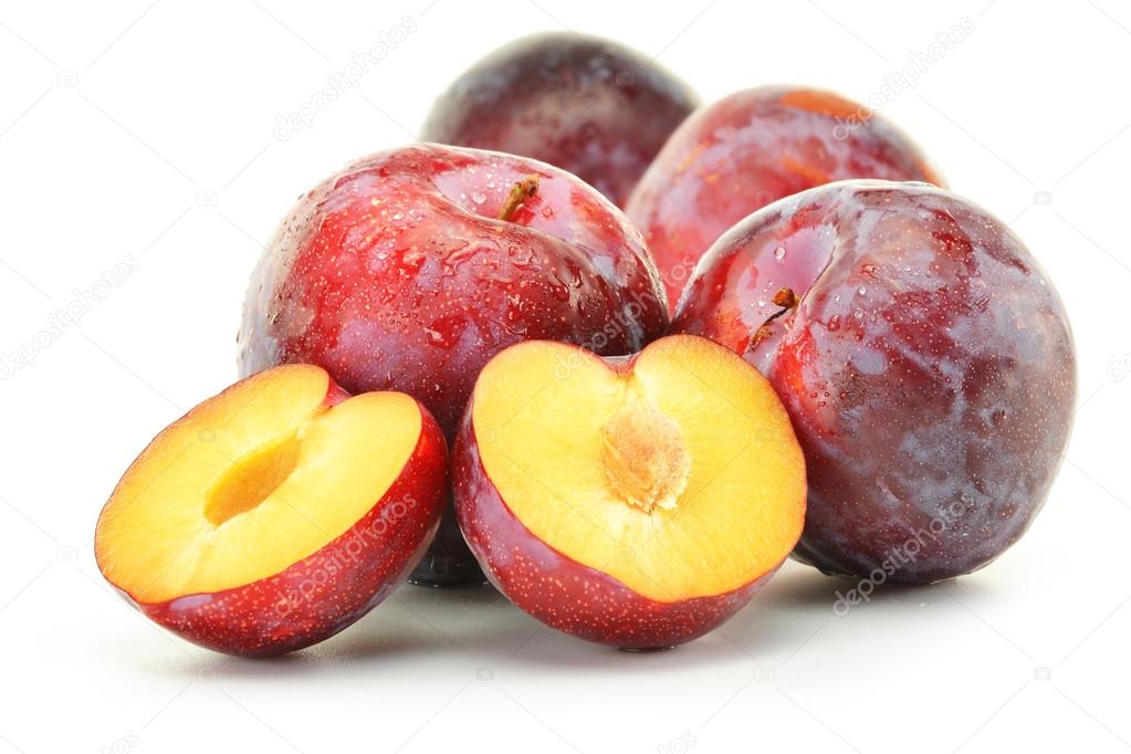 Composition with plums on white background