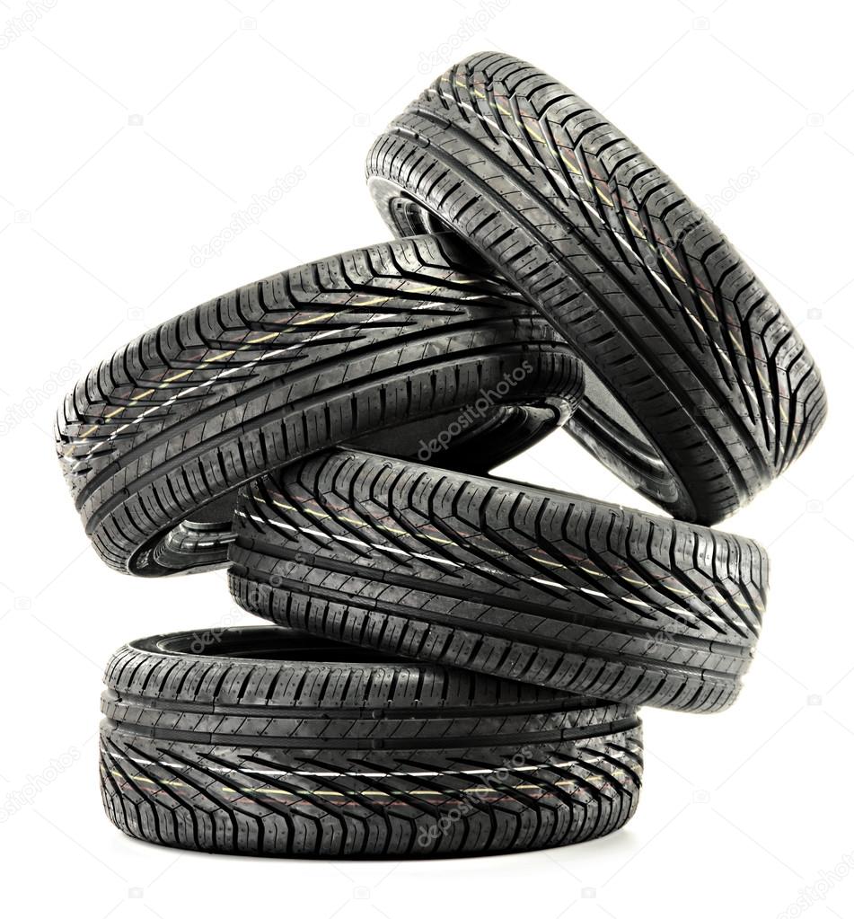 Four new black tires isolated on white