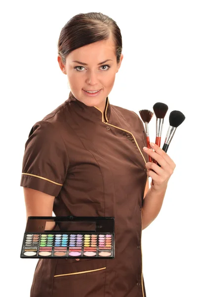 Professional beautician holding brushes — Stock Photo, Image