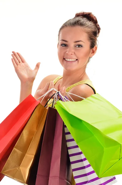 Young woman with shopping bags isolated on white — Stock Photo, Image