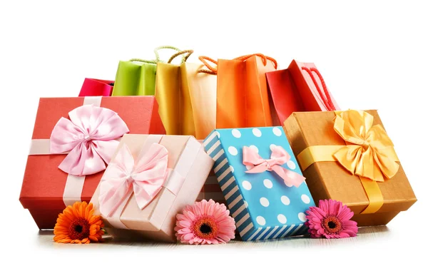 Colorful gift boxes and bags isolated on white — Stock Photo, Image