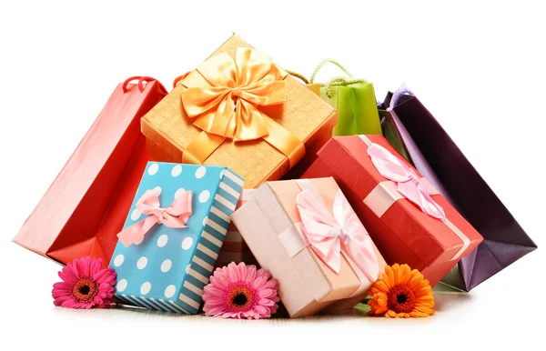 Colorful gift boxes and bags isolated on white — Stock Photo, Image