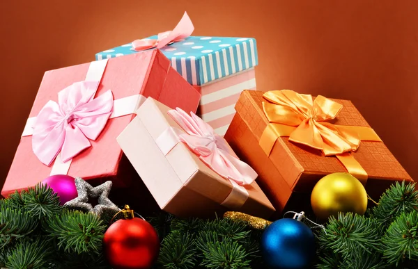 Colorful gift boxes and christmas tree — Stock Photo, Image