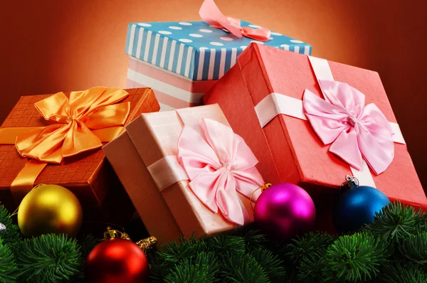 Colorful gift boxes and christmas tree — Stock Photo, Image