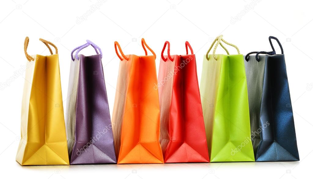 Colorful paper shopping bags isolated on white