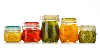 Jars with pickled vegetables and fruity compotes on white clipart