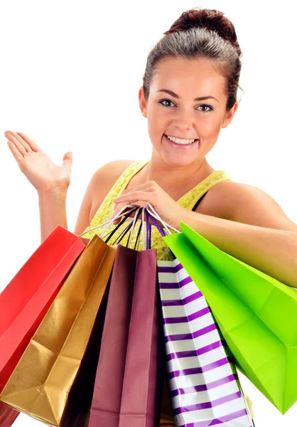 Young woman with paper shopping bags isolated on white — Stock Photo, Image