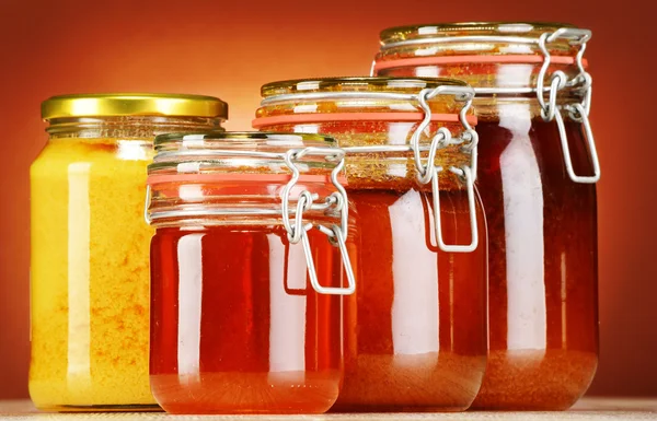 Composition with jars of honey — Stock Photo, Image