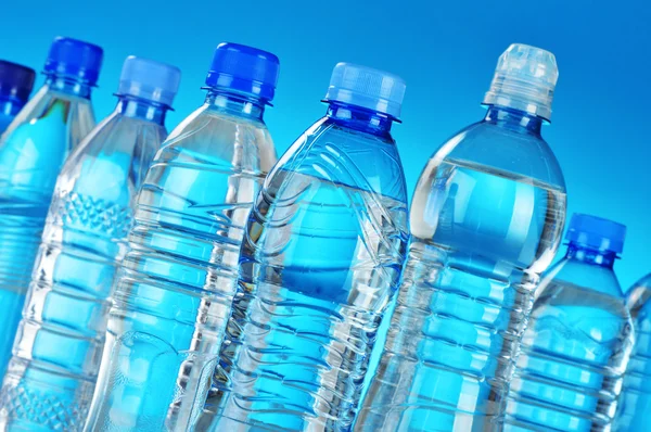 Composición con botellas de plástico surtido de agua mineral — Foto de Stock